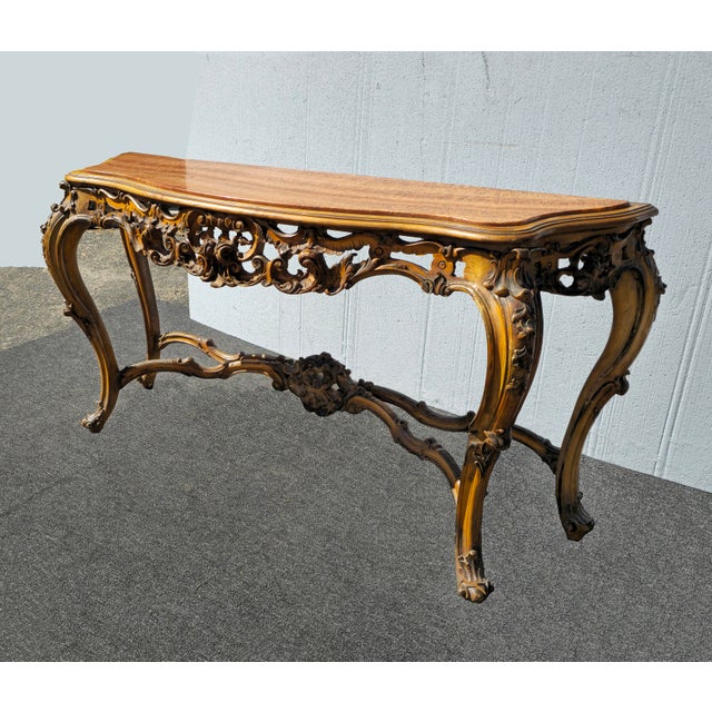 Gorgeous Console Table in Good Vintage Condition. Solid and Firm. The marble top has hair line cracks otherwise, wear is...