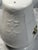 Lovely salt & pepper shakers each have their stoppers. White porceelain with a bulbouse shape and floral accent. Will go...