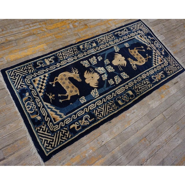 Antique Chinese - Baotou Small Scatter Size Wool Blue Rug, Circa Date: 1920s. This exceptional Baotou piece captures the...