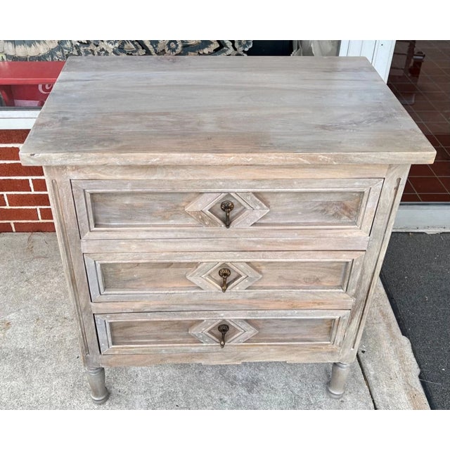 This Coastal Sleek Shanghai chest features three drawers and is crafted from carved solid wood with a natural driftwood...
