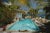 Pool At Las Hadas 1974 by Slim Aarons Slim Aarons Limited Estate Edition Guests round the pool at Las Hadas, Manzanillo,...