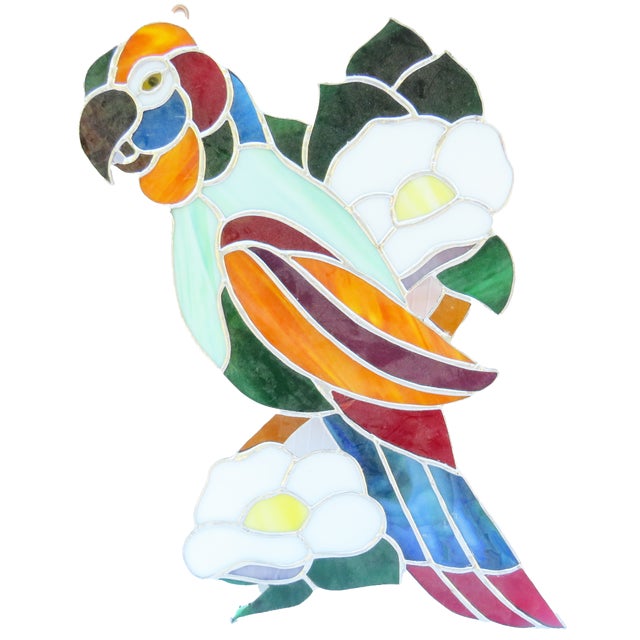Colorful mid-century leaded art glass piece featuring a parrot / macaw perched admist lovely camillia blossoms and their...