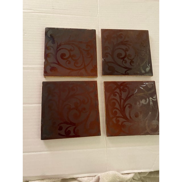 An exceptional, matching set of four (4) antique American art pottery tiles produced by the renowned American Encaustic...