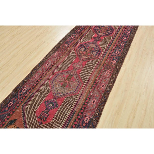 This authentic vintage tribal Sarab runner is hand-knotted with fine wool and natural dyes. This nomadic oriental rug...