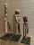 A trio of carved slingshots from West Africa. Used by children for target practice and hunting small animals, they were...