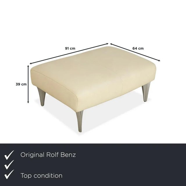 This stool from Rolf Benz's 1600 series is upholstered in cream-colored genuine leather and stands on simple, elegant...