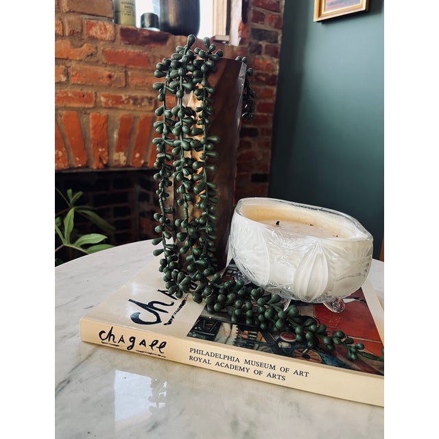 This Mid-Century Bronze Vase features a bold spiral design, with a rich, naturally aged surface that suggests decades of...