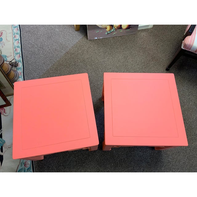 20th century Lane Chinoiserie side tables, pair. They have been painted in a coral finish.side fretwork detail. Pieces are...
