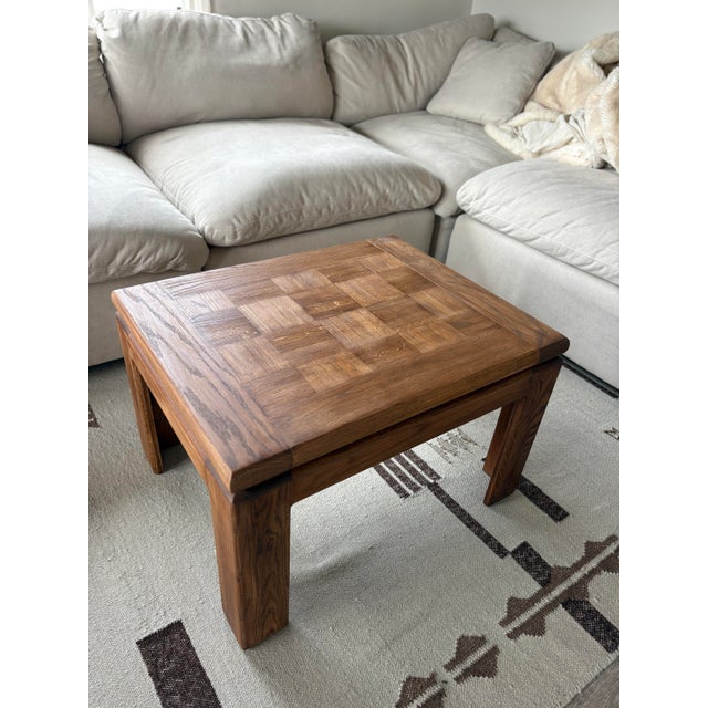 Beautiful vintage solid wood coffee table featuring a parquet-top design and rich walnut finish. Recently restored by...