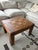 Beautiful vintage solid wood coffee table featuring a parquet-top design and rich walnut finish. Recently restored by...