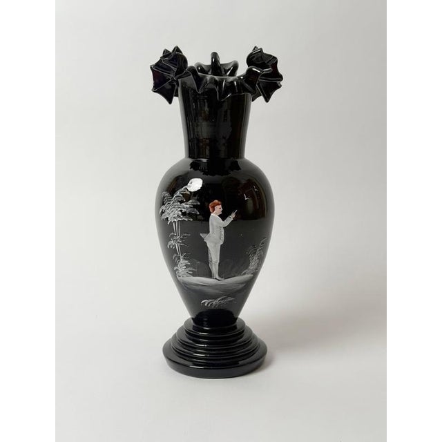 Antique Bohemian deep ruby glass vase, circa 1890–1910, with a finely hand-painted romantic enamel scene. In normal light,...