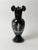 Antique Bohemian deep ruby glass vase, circa 1890–1910, with a finely hand-painted romantic enamel scene. In normal light,...