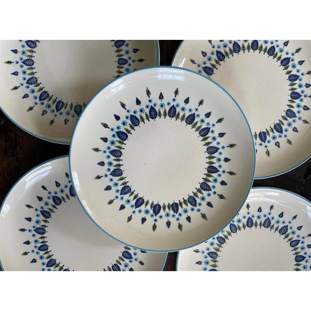 Charming set of five dinner plates, presented in the Swiss chalet pattern by Marcrest, A soft white with a pattern of...