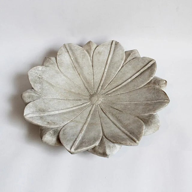 Hand carved white marble lotus plate. Each slightly unique in natural marble tones/veining and handmade characteristics.