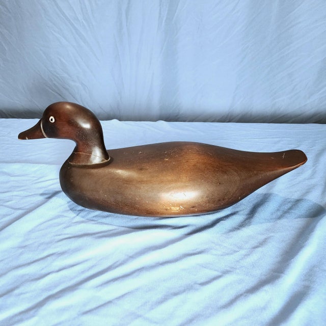 Solid hard wood, carved duck decoy. Some scuffs & scratches, see photos. Overall good condition. Measures approximately...