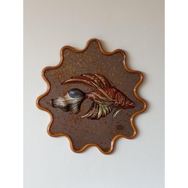 An artistic mirror by Mauro Pieroni (Florence). This is a rather unique decorative piece. The sculpture depicts a fish in...