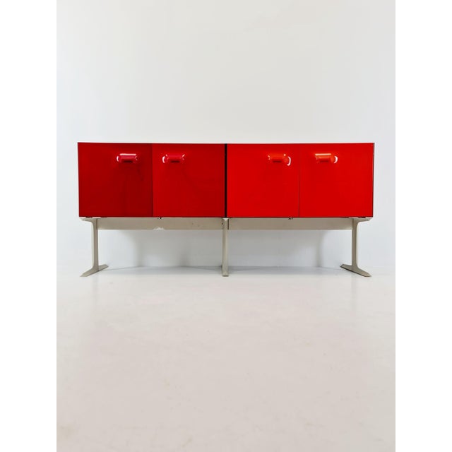 Df2000 sideboard by raymond loewy – iconic french design – red plastic doors – 1970s rare and iconic df2000 sideboard...