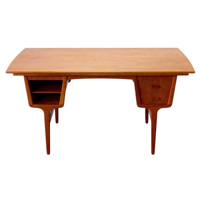 A very well-made and functional teak desk, designed by Carl Aage Skov for Munch Møbler in Denmark. The teak has a warm...
