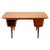 A very well-made and functional teak desk, designed by Carl Aage Skov for Munch Møbler in Denmark. The teak has a warm...