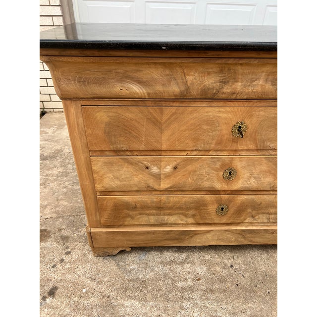 This elegant French 19th century Louis Philippe commode is crafted from beautifully bleached wood and topped with its...