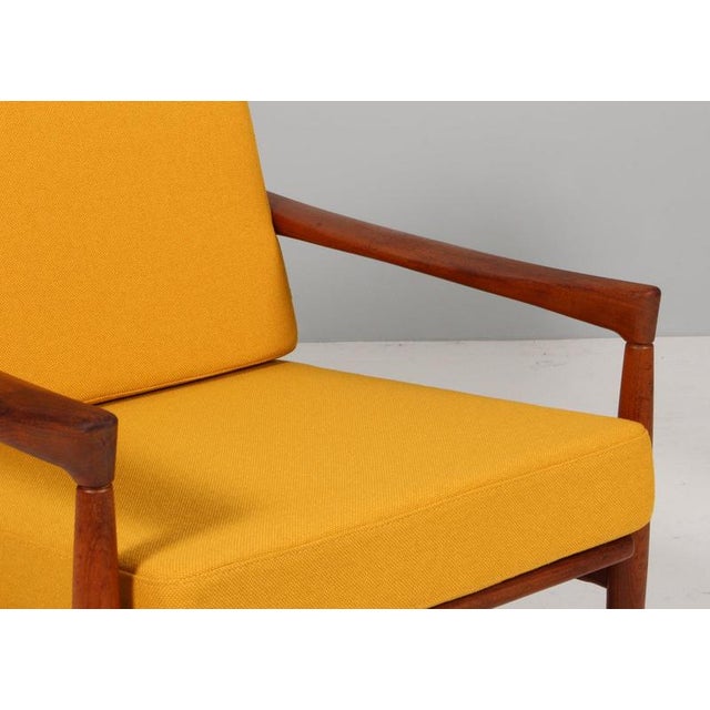 Erik Wørts lounge chair sofa new upholstered with yellow fabric from Nevotex. Frame of teak. Made for Ikea. This piece is...