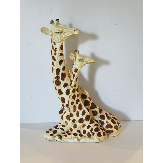 Two recumbent giraffes plaster sculpture handpainted.