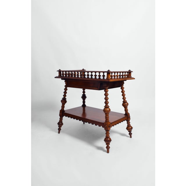 Turned wood english console, 1910s. Console table in turned wood resting on four tapered legs, a frieze drawer under the...