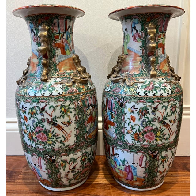Beautiful antique pair of tall rose medallion vases from the mid-19th century in excellent condition. Vases have gilded fu...