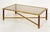 A fine French Modern rectangular cocktail or coffee low table, featuring an elegant brass frame with an inset top of...