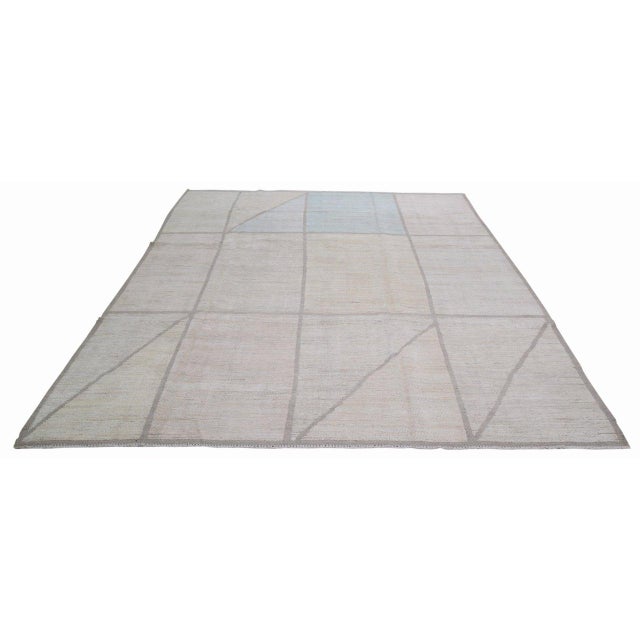 Hand-knotted with care using traditional rug-making techniques, this wool rug blends timeless craftsmanship with a modern...