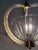 Beautiful and distinctive Italian pendant chandelier from the 1930s, handcrafted in clear Murano glass with brass details....