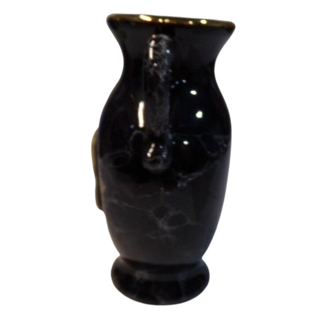 Add timeless elegance to your collection with this striking vintage vase from Japan. Featuring a deep black finish...