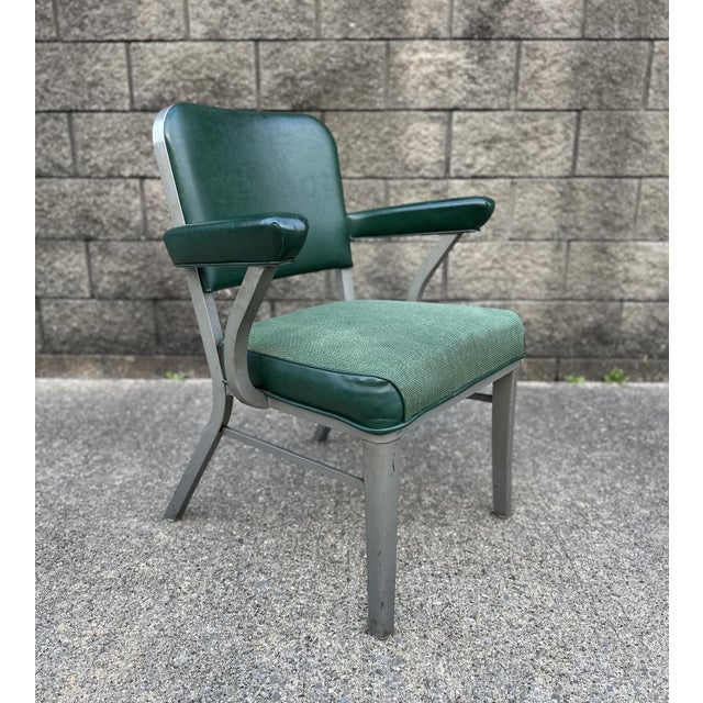 Mid-Century Steelcase aluminum arm chair with original green fabric and vinyl upholstery. This vintage Industrial Chair is...