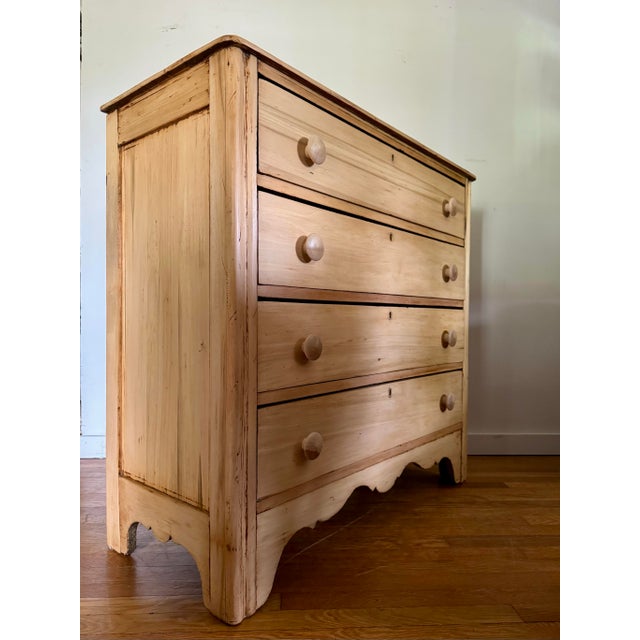 Restored late 19th century Pennsylvania scrubbed pine chest of drawers with four even sized drawers and wooden knobs. All...