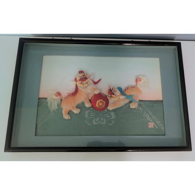 This is a vintage Chinese 3D shadowbox relief artwork depicting the traditional motif "Two Lions Playing with a Silk Ball"...