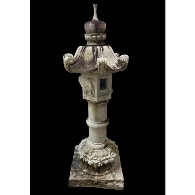 Crafted with traditional Japanese craftsmanship, this magnificent 67-inch (approx. 5.5 ft) pedestal stone garden lantern...