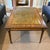 Maitland Smith Eglomise Glass Coffee Table Reverse painted glass top with neoclassical details along the apron and legs....