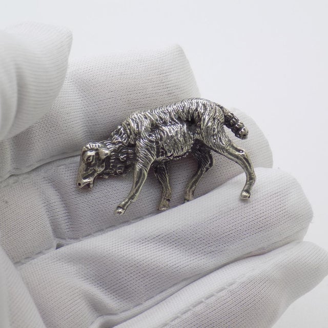 A solid, rare, and highly detailed piece, featuring remarkably refined workmanship that captures the fleece and...