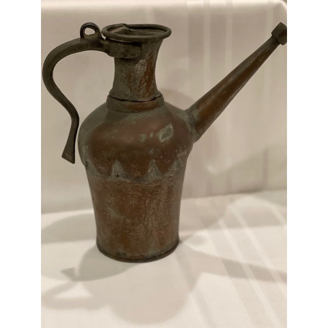 This is an antique Turkish copper watering can or ewer. These pieces are typically hand-forged or hand-hammered and made...