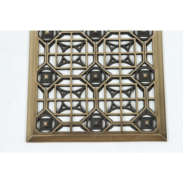 Bronze grille. The design style can work in a variety of settings: Art Deco, Gothic, Contemporary, Moorish.