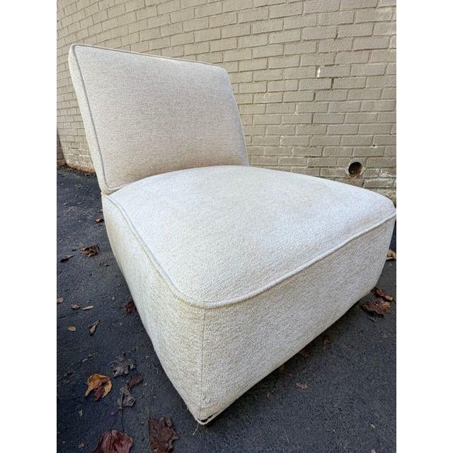 Generously proportioned armless lounge chairs by Lee Industries upholstered in a warm ivory textured fabric. Clean,...