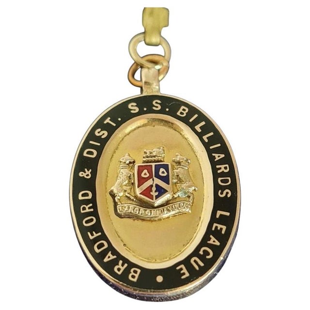 A distinctive antique british sporting medallion by the renowned firm fattorini & sons ltd, crafted in 9-carat yellow gold...