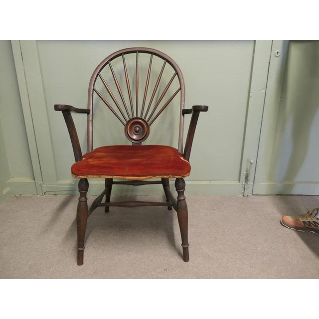 An Arts and Crafts Windsor Carver Chair This is a one off piece, the chair back has a large carved roundel and from this...