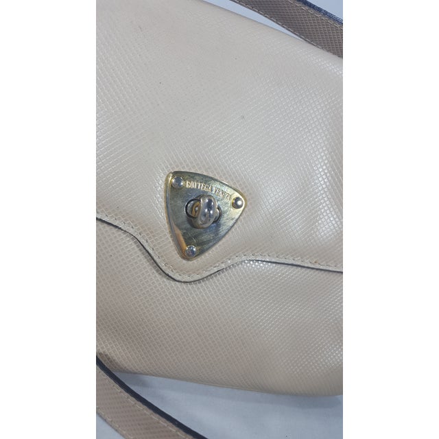 1980s Bottega Veneta cream leather handbag with adjustable strap. Perfect for cross body or shoulder bag. Gold Hardware...