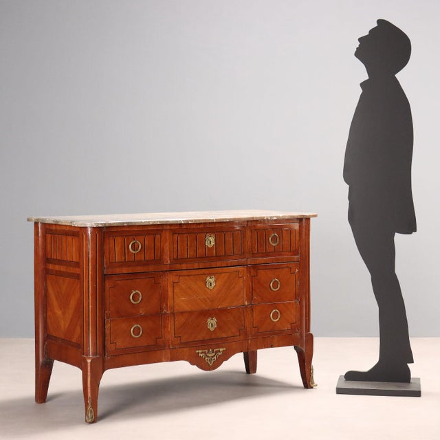 Louis XVI-style chest of drawers in mahogany, rosewood veneer, maple and ebonized maple trim, oak interior. Curved front...