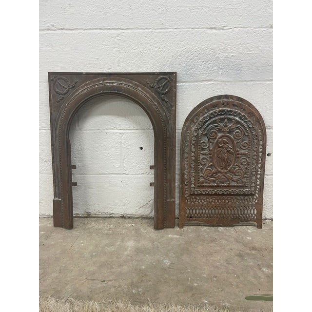 Original and unaltered - A remarkable late 19th-century American Victorian cast-iron fireplace surround complete with its...
