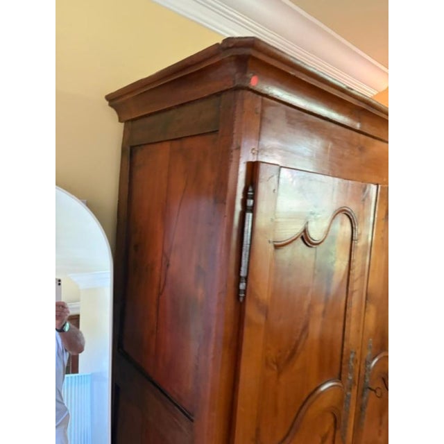 This 18th century antique walnut two-door French armoire is a beautifully crafted piece of furniture. Made of solid wood...
