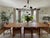 A pair of authentic Glass Up Down wall sconces by In Common With, featuring black steel hardware and hand-crafted...