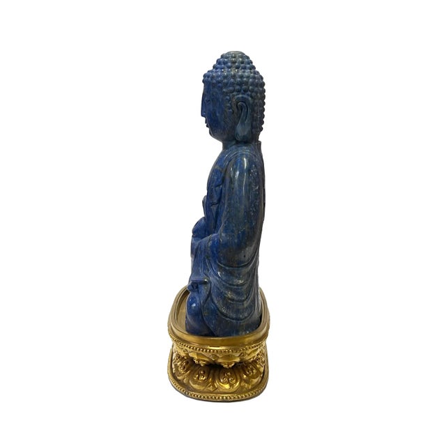 This is a nicely carved Chinese meditation sitting Buddha Statue figure with a decorative motif and blue color natural...