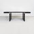 Dining table model Orseolo with rectangular top in black lacquered wood, like the entire structure. The structure is made...
